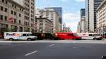Camions de livraison FedEx, UPS, Purolator et Canada Post côte à côte dans une rue canadienne